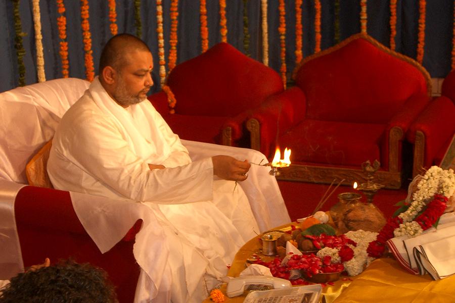 Brahmachari Ji is doing Akshaya Tritiya Puja at Maharishi Hall in Kutia in April 2004. His Holiness Maharishi Mahesh Yogi Ji is connected on conference phone. 
